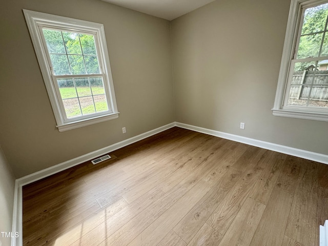 3804 Cobb St, Garner, NC 27529 - unfurnished room with baseboards, healthy amount of natural light, and wood finished floors