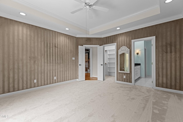 2001 Dobson Ct, Raleigh, NC 27612 - unfurnished bedroom with a raised ceiling, carpet, crown molding, a spacious closet, and recessed lighting