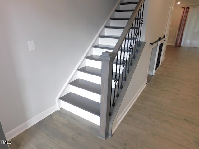1311 Arena Ln, Fuquay Varina, NC 27526 - stairs featuring baseboards and wood finished floors