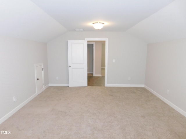 1311 Arena Ln, Fuquay Varina, NC 27526 - additional living space featuring vaulted ceiling, light colored carpet, and baseboards