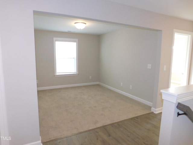 1311 Arena Ln, Fuquay Varina, NC 27526 - empty room featuring baseboards, wood finished floors, and carpet
