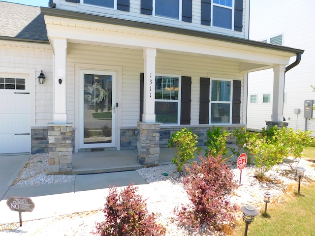 1311 Arena Ln, Fuquay Varina, NC 27526 - doorway to property featuring a porch, stone siding, and roof with shingles