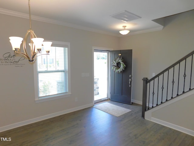 1311 Arena Ln, Fuquay Varina, NC 27526 - entrance foyer featuring wood finished floors, crown molding, a chandelier, stairs, and baseboards