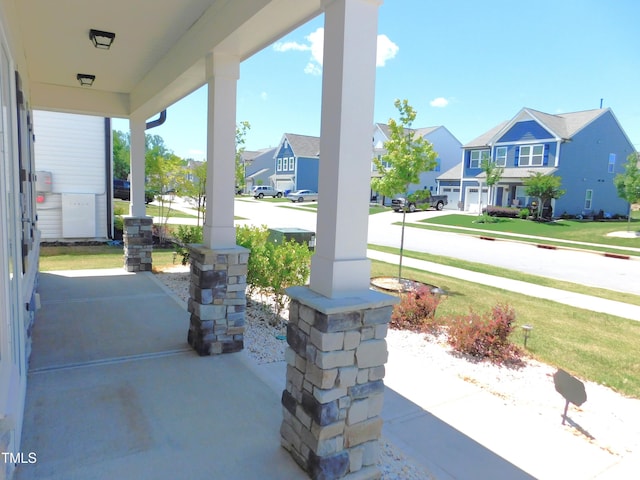 1311 Arena Ln, Fuquay Varina, NC 27526 - covered porch featuring a residential view and a yard