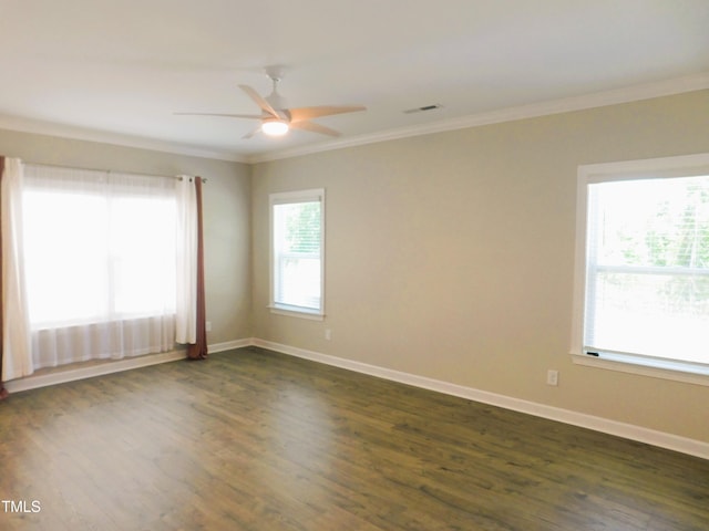 1311 Arena Ln, Fuquay Varina, NC 27526 - unfurnished room featuring crown molding, plenty of natural light, dark wood finished floors, ceiling fan, and baseboards