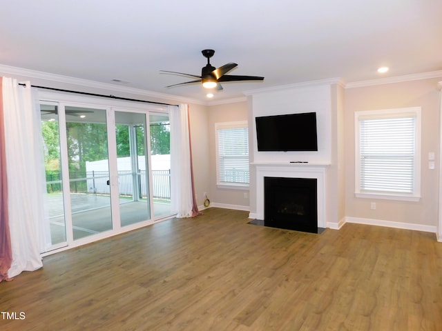 1311 Arena Ln, Fuquay Varina, NC 27526 - unfurnished living room featuring a ceiling fan, baseboards, wood finished floors, ornamental molding, and a fireplace with flush hearth
