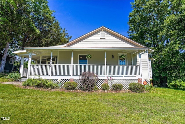 5625 Church Rd, Graham, NC 27253 - view of front facade with covered porch and a front yard