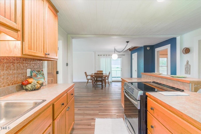 5625 Church Rd, Graham, NC 27253 - kitchen featuring stainless steel range with electric stovetop, light countertops, light wood-style flooring, a sink, and wood ceiling
