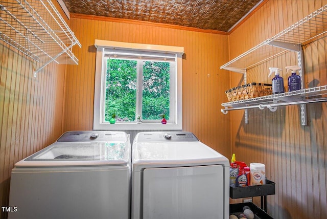 5625 Church Rd, Graham, NC 27253 - laundry room with washing machine and clothes dryer, crown molding, an ornate ceiling, and wooden walls