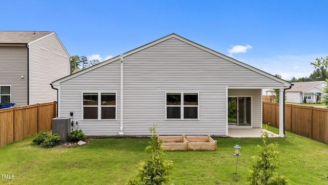 1401 Justice Union Ct, Raleigh, NC 27604 - rear view of house featuring central air condition unit and a vegetable garden