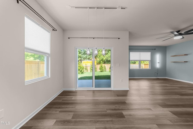 1401 Justice Union Ct, Raleigh, NC 27604 - unfurnished room with wood finished floors, track lighting, ceiling fan, and baseboards