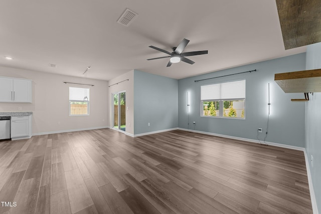 1401 Justice Union Ct, Raleigh, NC 27604 - unfurnished living room with a ceiling fan, healthy amount of natural light, and light wood-style floors
