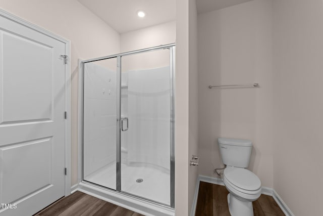 1401 Justice Union Ct, Raleigh, NC 27604 - full bath featuring wood finished floors, toilet, a shower stall, and baseboards