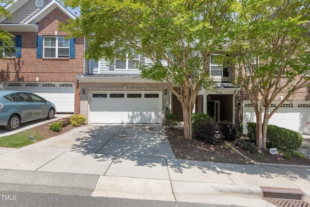2082 Weston Green Loop, Cary, NC 27513 - view of front facade featuring brick siding, concrete driveway, and a garage