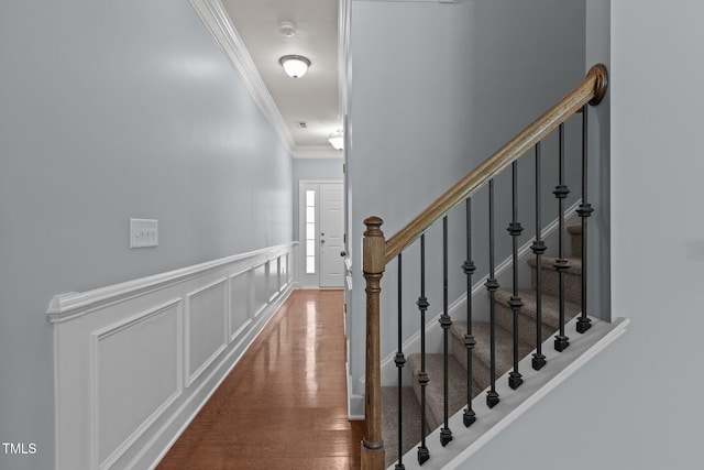 2082 Weston Green Loop, Cary, NC 27513 - corridor featuring crown molding, wood finished floors, a wainscoted wall, a decorative wall, and stairway
