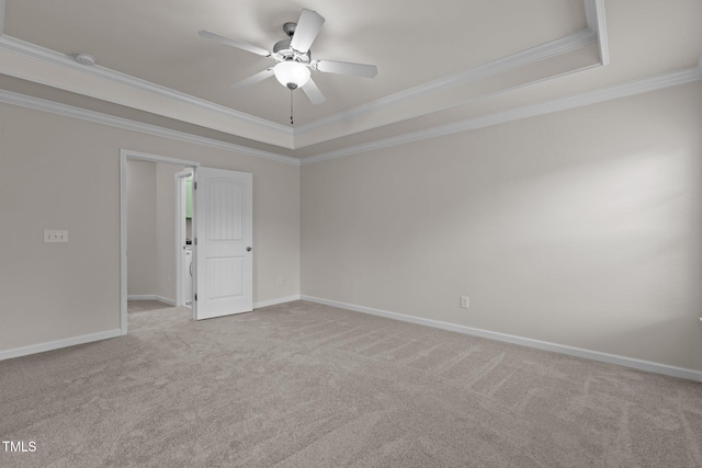 2082 Weston Green Loop, Cary, NC 27513 - unfurnished room featuring a tray ceiling, ornamental molding, ceiling fan, carpet floors, and baseboards