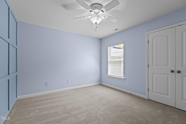 2082 Weston Green Loop, Cary, NC 27513 - unfurnished bedroom featuring baseboards, carpet, a closet, and a ceiling fan