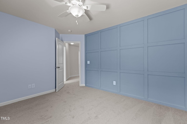 2082 Weston Green Loop, Cary, NC 27513 - unfurnished bedroom featuring light colored carpet, a decorative wall, baseboards, and ceiling fan