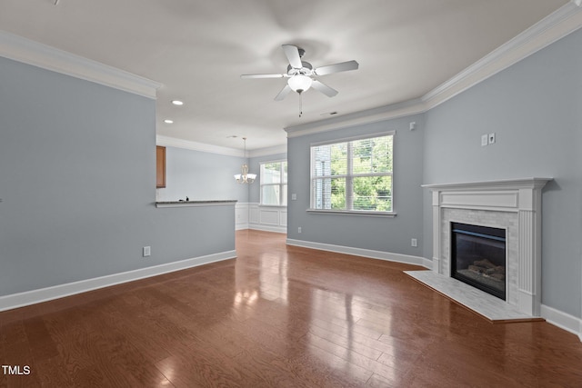 2082 Weston Green Loop, Cary, NC 27513 - unfurnished living room with crown molding, a fireplace, ceiling fan, baseboards, and a chandelier