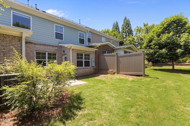 2082 Weston Green Loop, Cary, NC 27513 - back of house featuring brick siding