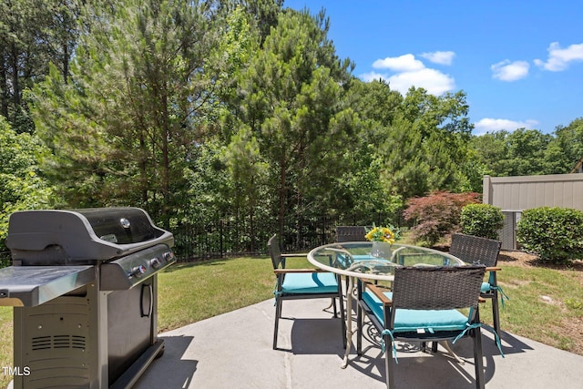 1896 Blue Jay Pt, Apex, NC 27502 - view of patio with outdoor dining area and a view of trees