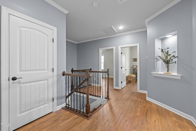 1896 Blue Jay Pt, Apex, NC 27502 - hall featuring an upstairs landing, baseboards, crown molding, wood finished floors, and recessed lighting