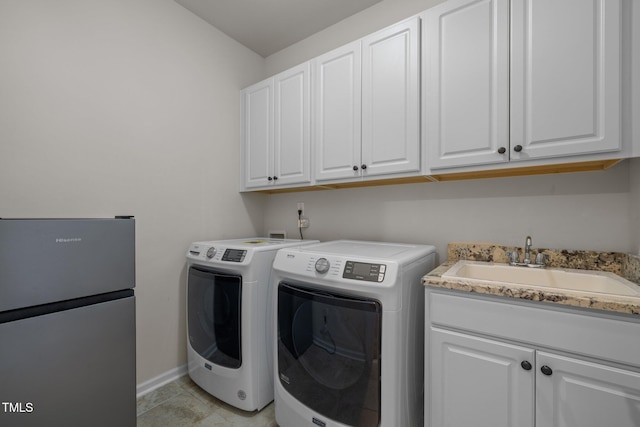 1896 Blue Jay Pt, Apex, NC 27502 - laundry area with washing machine and clothes dryer, cabinet space, and baseboards