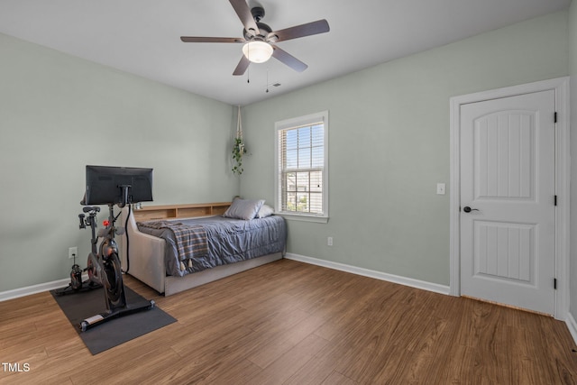 1896 Blue Jay Pt, Apex, NC 27502 - bedroom featuring wood finished floors, baseboards, and ceiling fan
