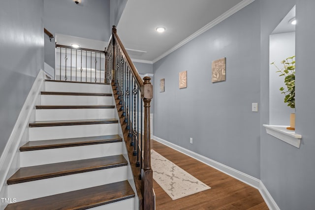 1896 Blue Jay Pt, Apex, NC 27502 - staircase featuring wood finished floors, ornamental molding, baseboards, and recessed lighting