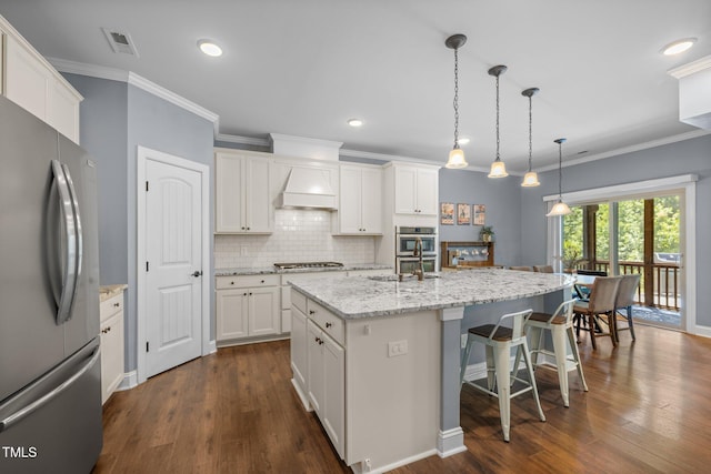 1896 Blue Jay Pt, Apex, NC 27502 - kitchen with stainless steel appliances, custom range hood, a sink, a kitchen island with sink, and a kitchen bar