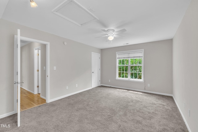 113 Feezor Ct, Clayton, NC 27527 - carpeted spare room featuring a ceiling fan and attic access