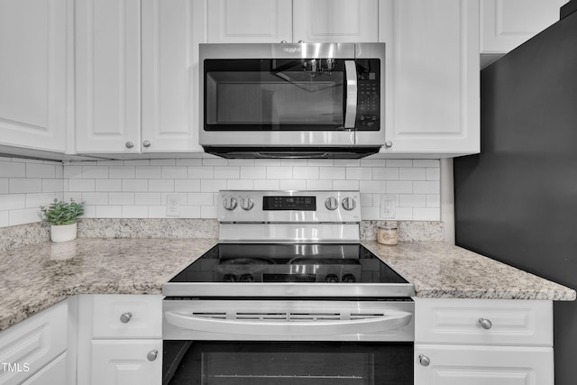 113 Feezor Ct, Clayton, NC 27527 - kitchen with stainless steel appliances, white cabinets, tasteful backsplash, and light stone countertops