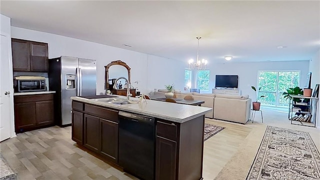 29 York Ct, Spring Lake, NC 28390 - kitchen with dishwasher, stainless steel fridge, a chandelier, light wood finished floors, and dark brown cabinetry