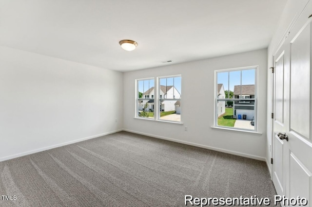 88 Mable Ct Unit 17, Lillington, NC 27546 - carpeted empty room with baseboards