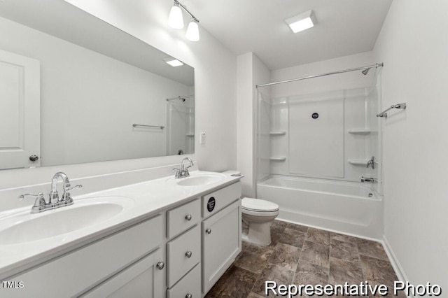 88 Mable Ct Unit 17, Lillington, NC 27546 - bathroom with double vanity, toilet, shower / bathtub combination, stone finish flooring, and baseboards