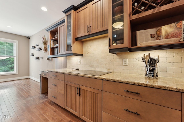 31 River View Ct, Timberlake, NC 27583 - kitchen featuring baseboards, open shelves, black electric stovetop, light stone countertops, and recessed lighting
