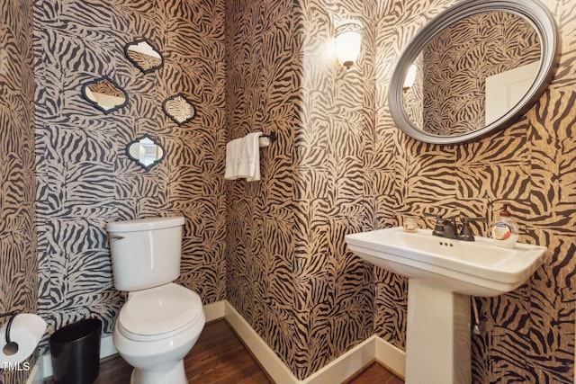 31 River View Ct, Timberlake, NC 27583 - half bathroom with wallpapered walls, toilet, wood finished floors, baseboards, and a sink