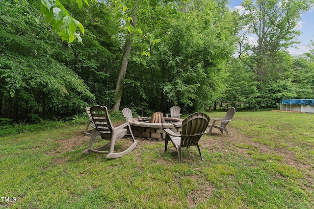 31 River View Ct, Timberlake, NC 27583 - view of grassy yard featuring an outdoor fire pit and a covered pool