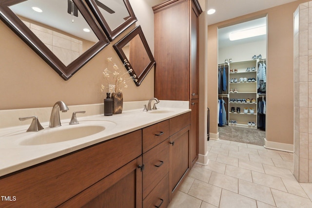 31 River View Ct, Timberlake, NC 27583 - full bathroom with double vanity, tile patterned floors, a spacious closet, baseboards, and recessed lighting