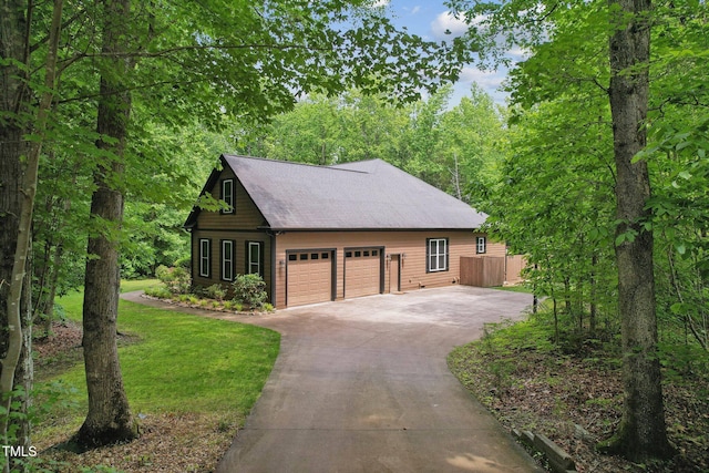 31 River View Ct, Timberlake, NC 27583 - view of front facade featuring a front lawn, a garage, and roof with shingles