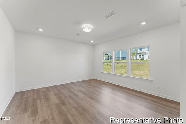 56 Mable Ct Unit 20, Lillington, NC 27546 - spare room featuring wood finished floors, baseboards, and recessed lighting