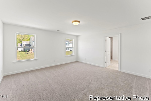 56 Mable Ct Unit 20, Lillington, NC 27546 - carpeted empty room with plenty of natural light and baseboards
