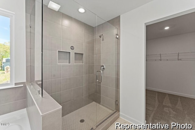 56 Mable Ct Unit 20, Lillington, NC 27546 - bathroom with a shower stall, a walk in closet, recessed lighting, and a tub to relax in