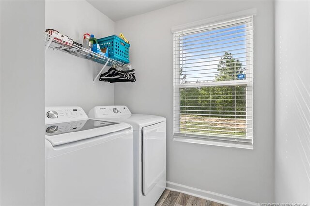 905 Sapphire Stone Ln, Hope Mills, NC 28348 - laundry area featuring independent washer and dryer, wood finished floors, and healthy amount of natural light