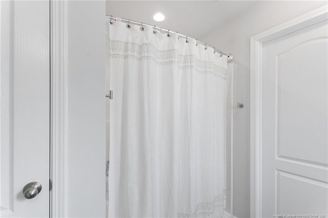 905 Sapphire Stone Ln, Hope Mills, NC 28348 - bathroom featuring a shower with shower curtain
