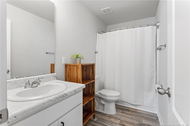 905 Sapphire Stone Ln, Hope Mills, NC 28348 - full bath featuring toilet, vanity, wood finished floors, and a shower with curtain