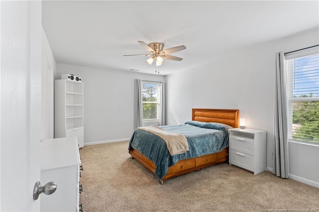 905 Sapphire Stone Ln, Hope Mills, NC 28348 - bedroom with multiple windows, light colored carpet, and baseboards