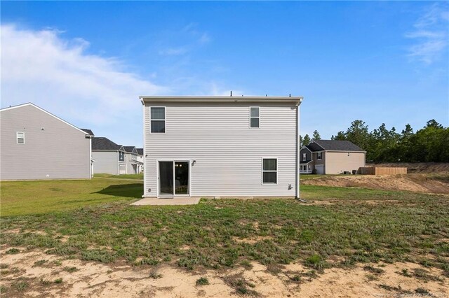 905 Sapphire Stone Ln, Hope Mills, NC 28348 - back of house featuring a yard and a patio