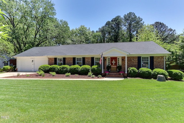 1206 Ivy Ln, Raleigh, NC 27609 - ranch-style home with a front lawn, a garage, driveway, and brick siding