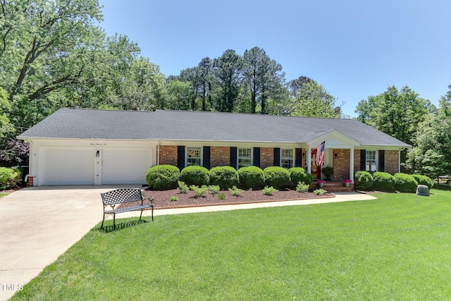 1206 Ivy Ln, Raleigh, NC 27609 - ranch-style house featuring a garage, a front yard, driveway, and brick siding